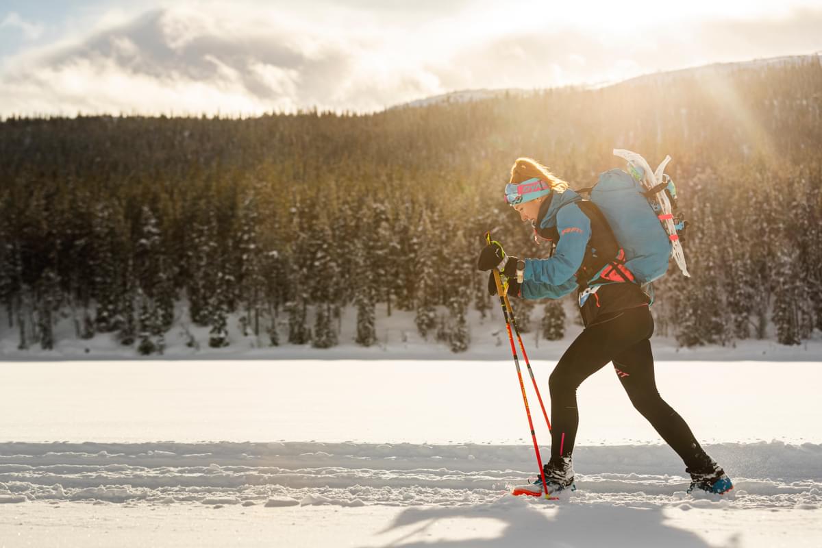A runner navigating the frozen lakes of Swedish Lapland during the BTU Ice Ultra