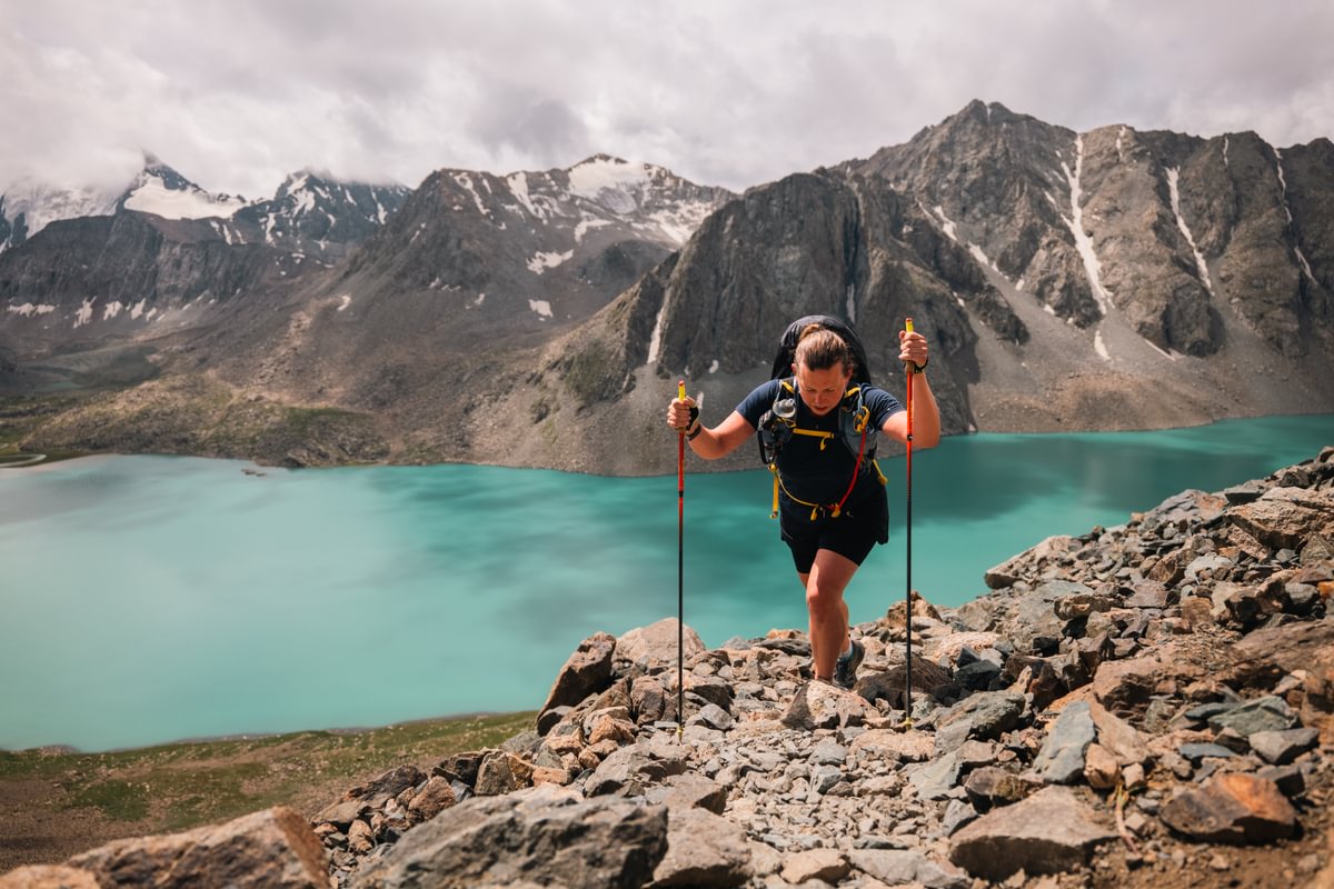 A runner racing through the Tian Shan Mountains during the BTU Mountain Ultra