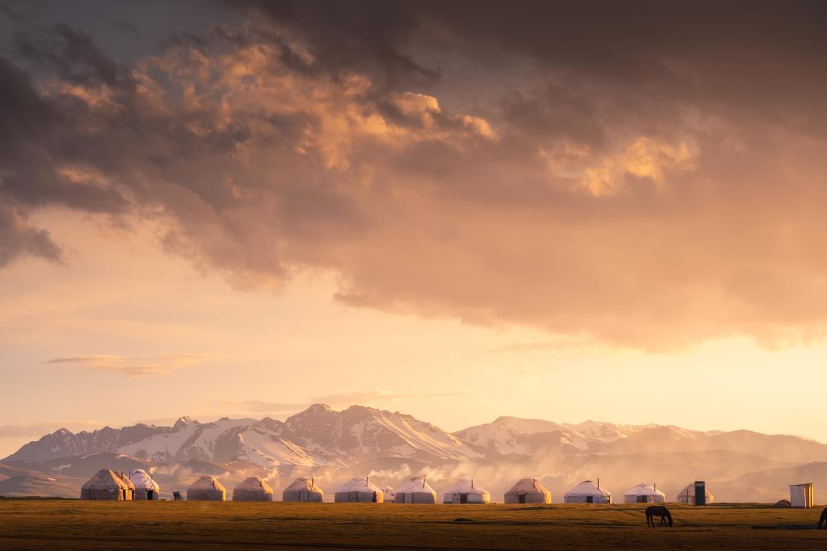 A runner racing through the Tian Shan Mountains during the BTU Mountain Ultra