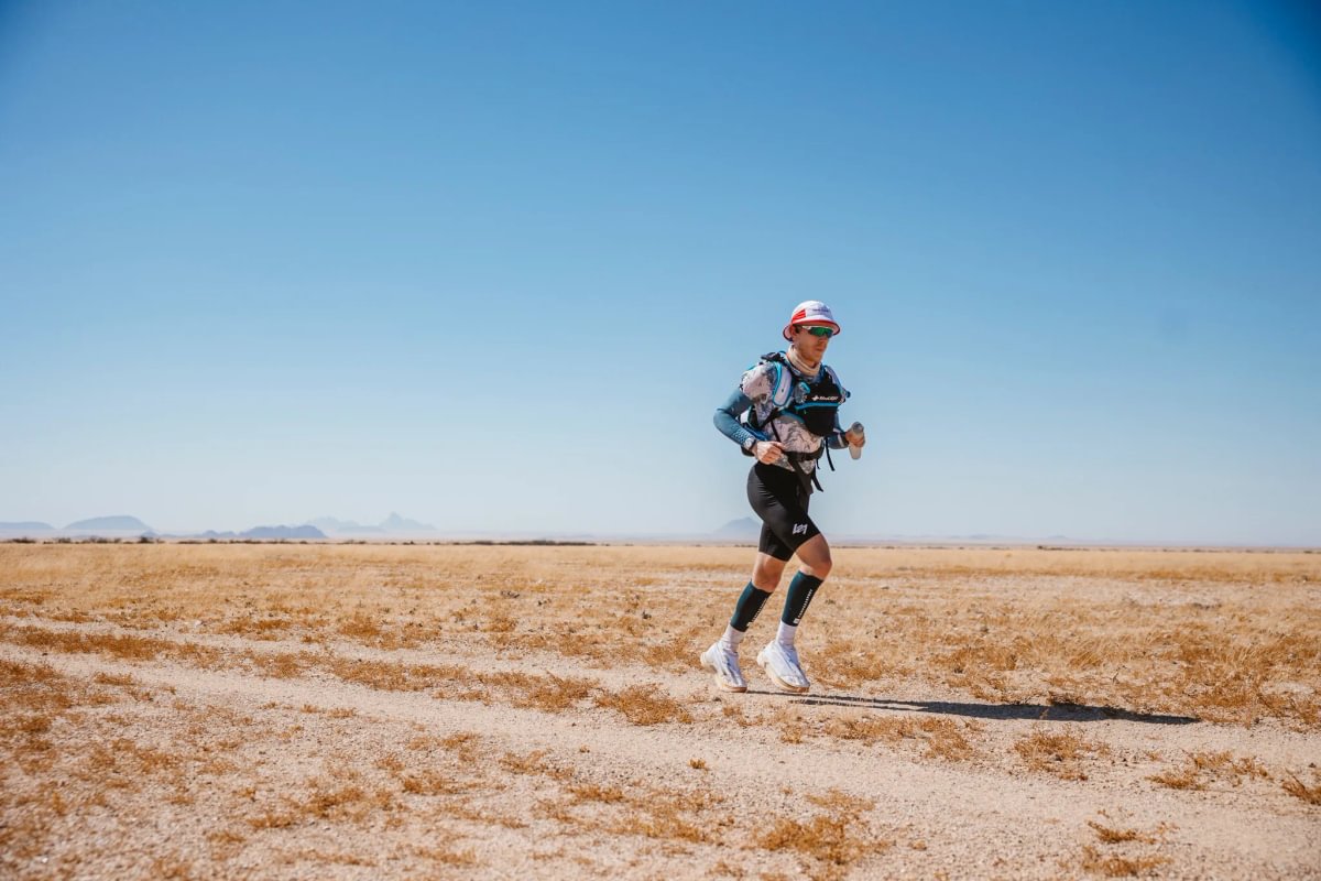 A runner racing through the Namib Desert during the BTU Desert Ultra