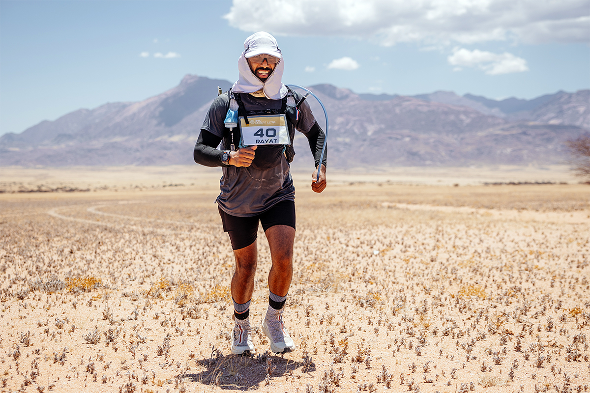 A runner racing through the Namib Desert during the BTU Desert Ultra