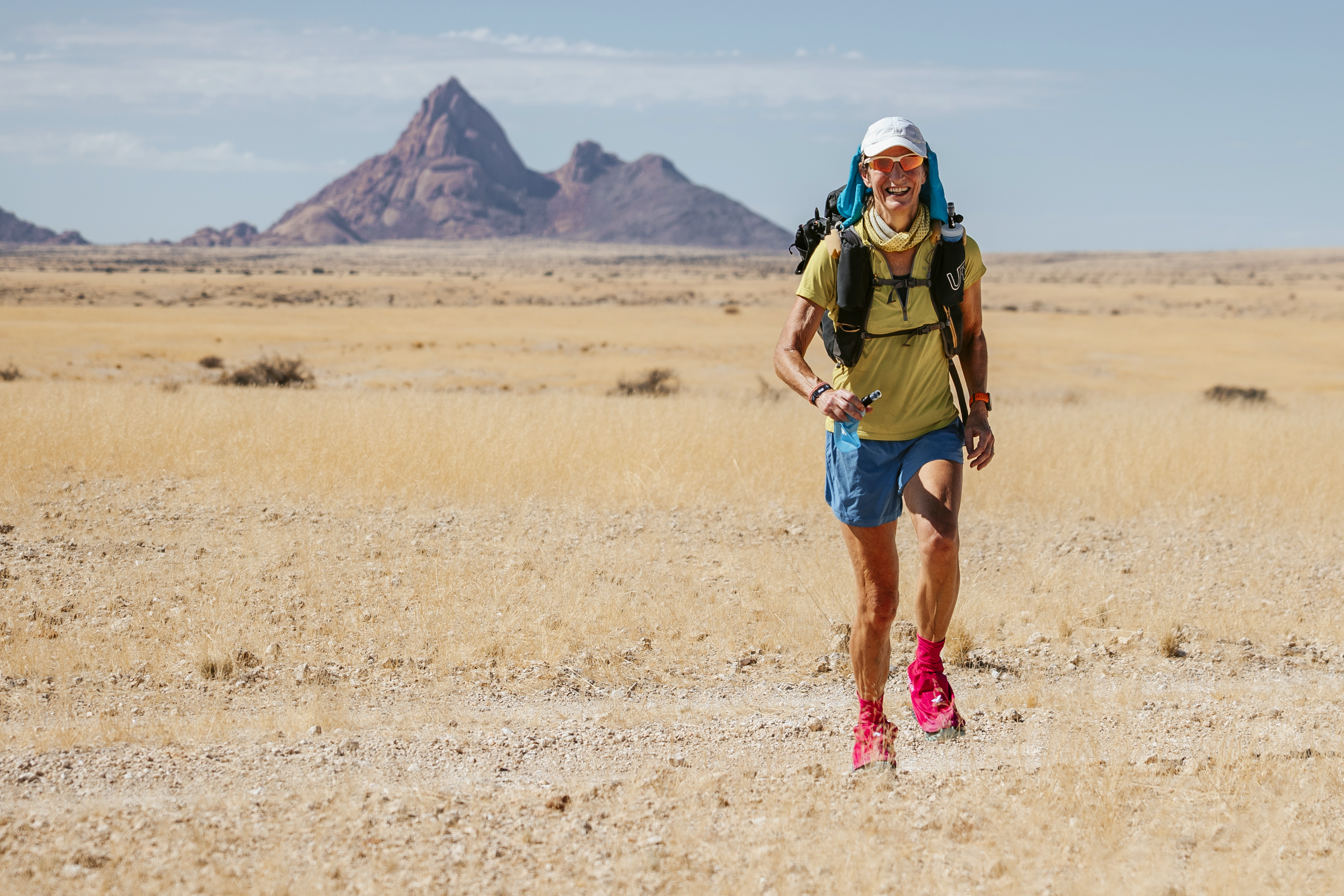 A runner racing through the Namib Desert during the BTU Desert Ultra